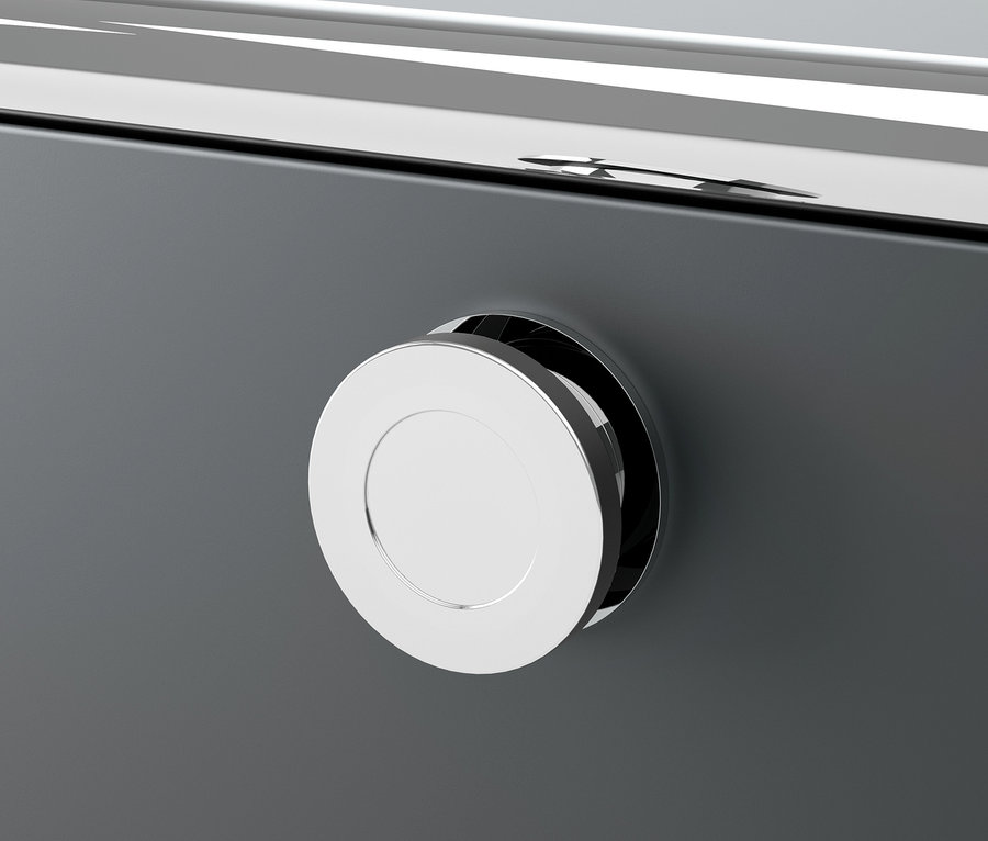 Detailaufnahme einer grauen Metallkommode CN3 mit einem runden, silberfarbenen Griff.