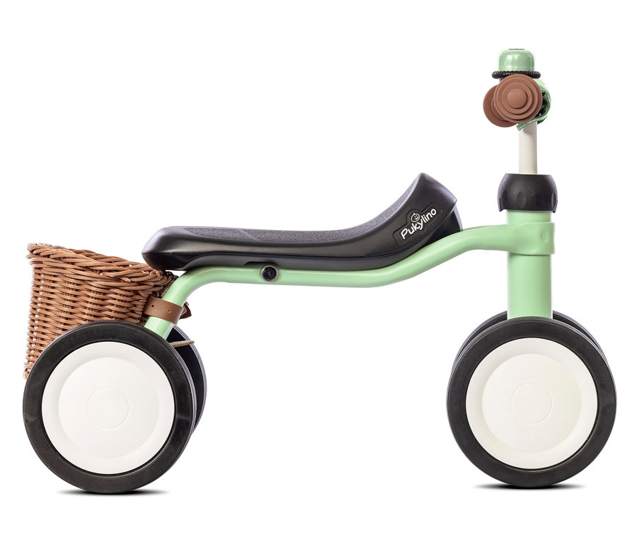 Nahaufnahme eines hellgrünen PUKY Laufrads PUKYLINO BUNDLE mit braunem Weidenkorb.