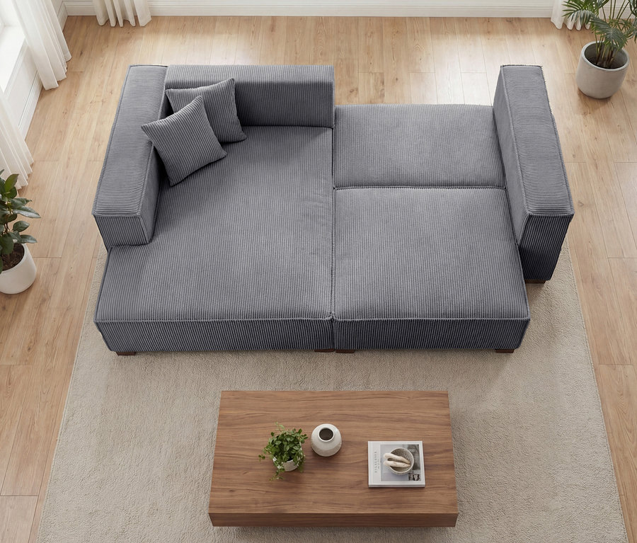 Graues modulares Sofa »Cumello« mit Longchair links und Ausziehbett rechts, von oben gesehen.