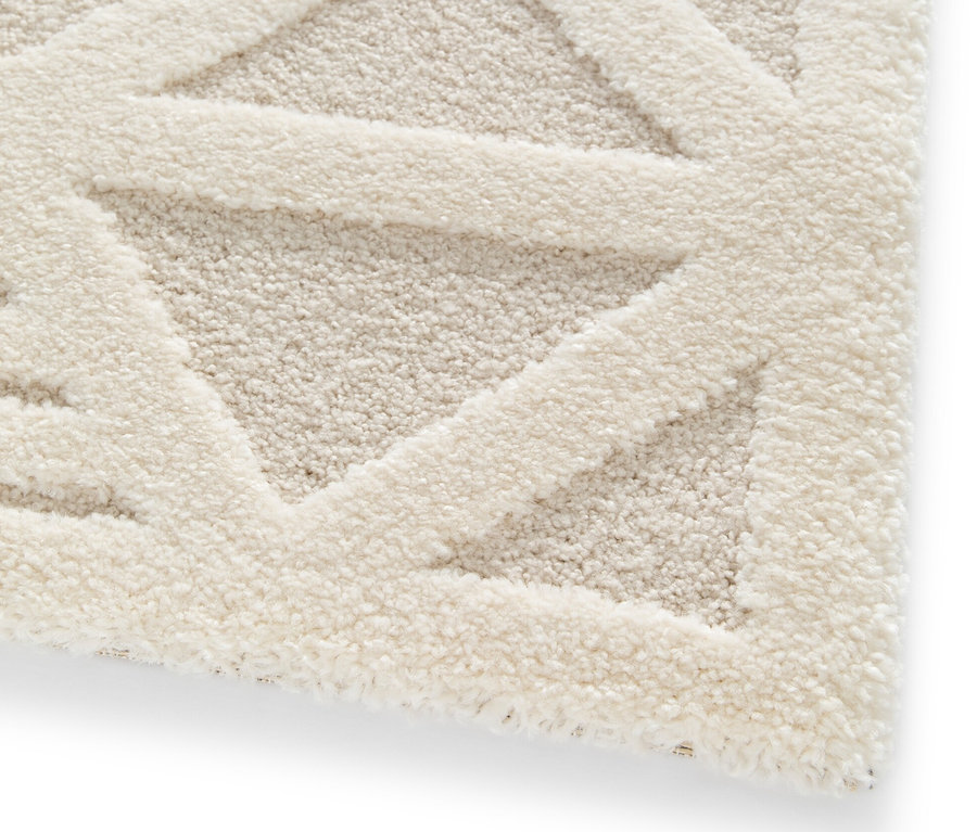 Detailaufnahme eines cremefarbenen Teppichs »Cosmo« Geo.