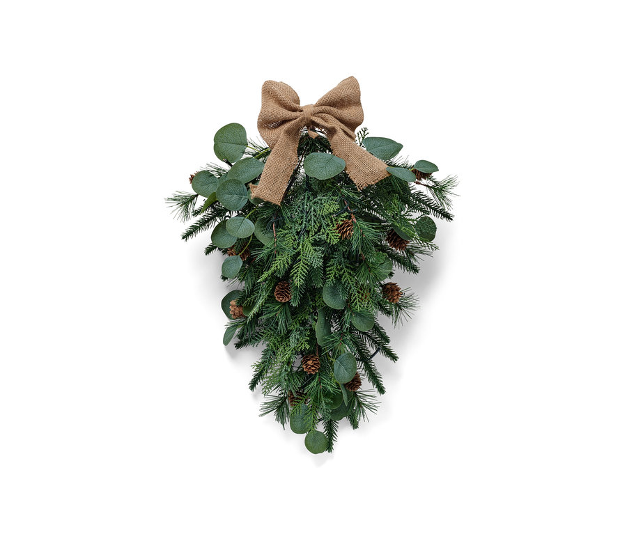 Grüne LED-Türdeko mit brauner Schleife und Zapfen.