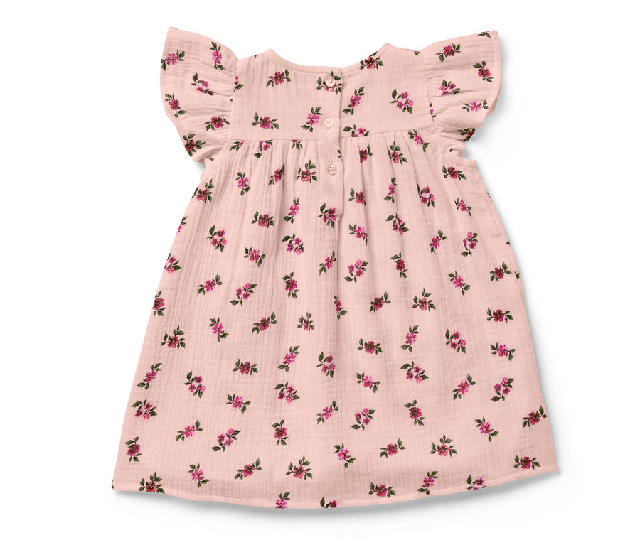 Ein Baby-Musselinkleid mit Blumenmuster.