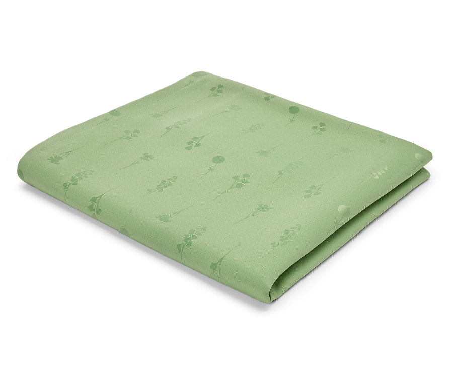 Ein hellgrünes Stoffserviette mit einem Muster aus Stängeln und Blüten.