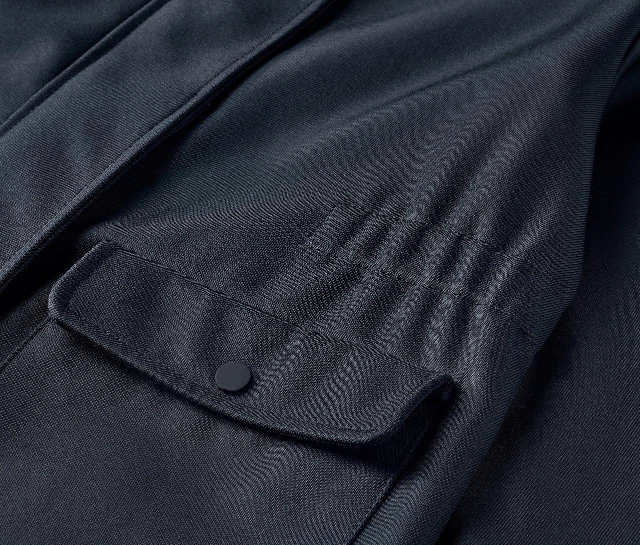 Detailansicht eines Kinder-Softshellmantels mit Tasche.