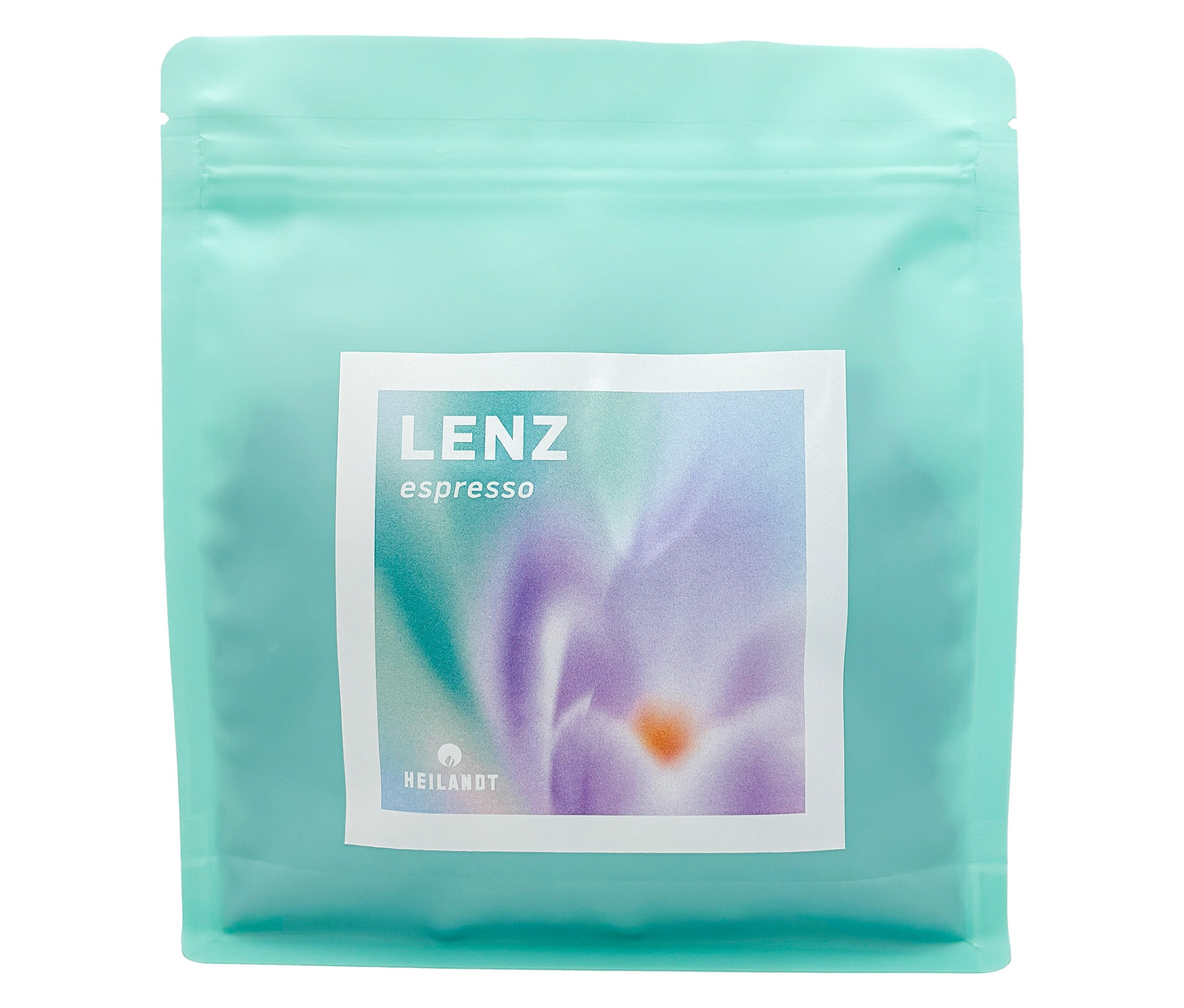 Eine hellblaue Packung Heilandt - Lenz Espresso mit einem weißen Etikett mit einer lila Blume darauf.