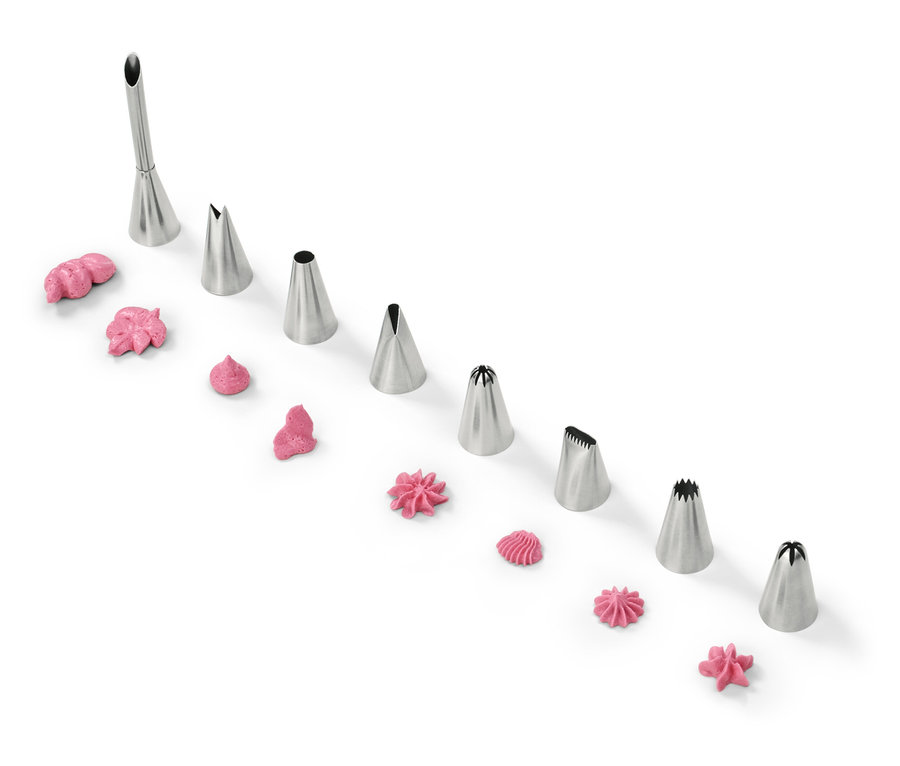 Dekorative Spritztüllen mit rosa Zuckerguss auf weißem Hintergrund.