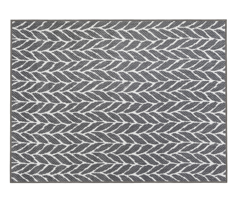 Grauer Outdoor-Wendeteppich »Knitted Joy« mit Fischgrätenmuster.