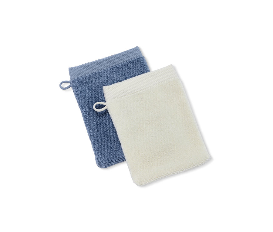 Zwei hochwertige blaue und weiße Waschlappen.