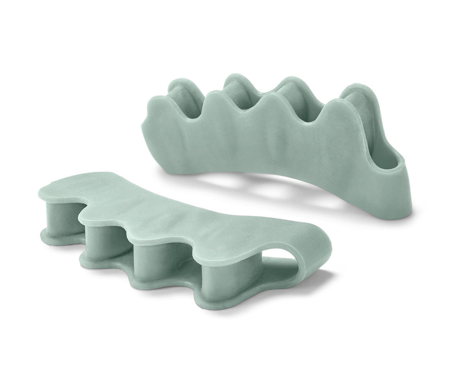 Zwei hellgrüne Zehenspreizer.