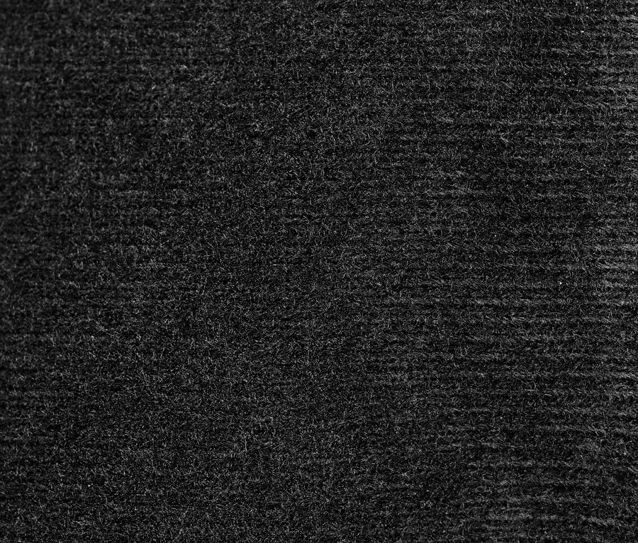 Detailaufnahme der Textur von Lederhandschuhen.