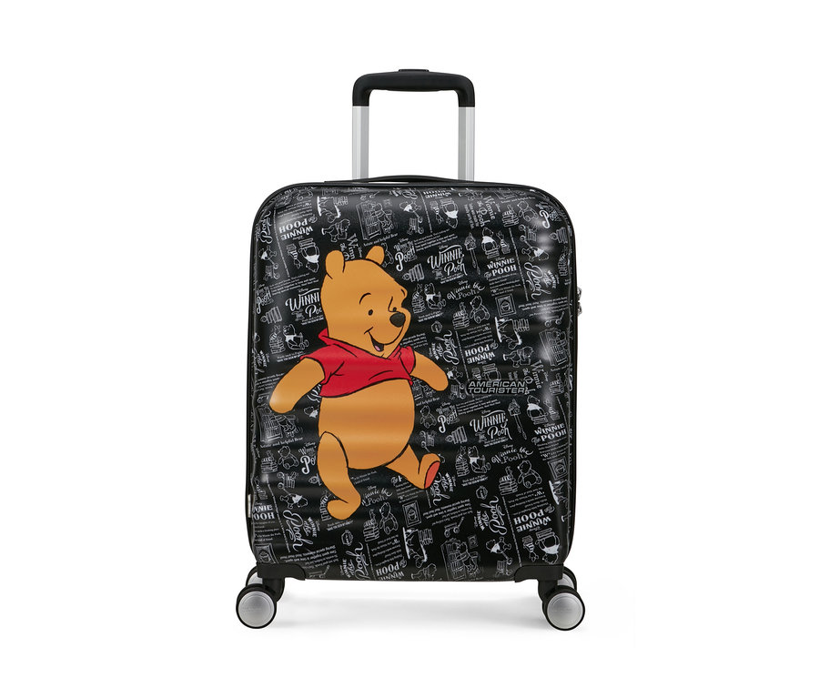 Kleiner schwarzer American Tourister Wavebreaker Koffer mit Winnie Puuh Motiv.