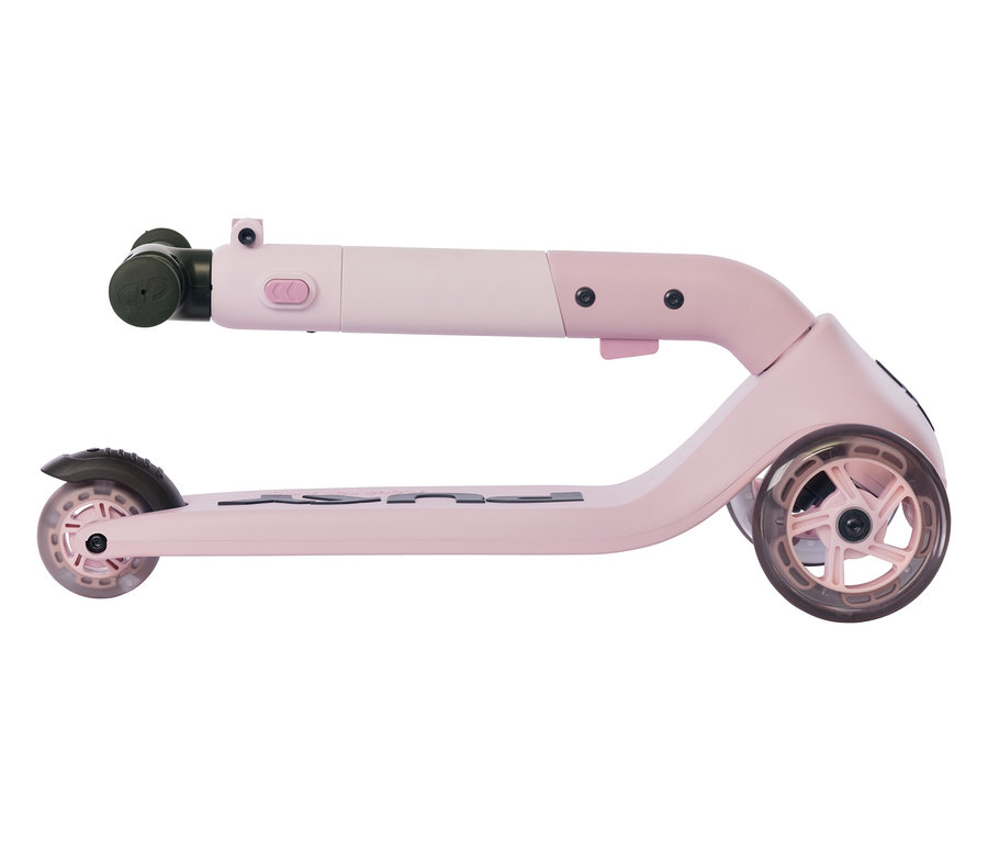 Nahaufnahme des zusammengeklappten PUKY Roller PUSH in Rosa und Weiß, der auf einer ebenen Fläche liegt.