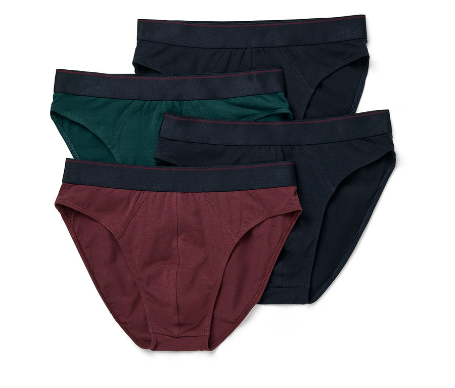 Fünf Herrenslips in Dunkelblau, Grün und Weinrot liegen übereinander.