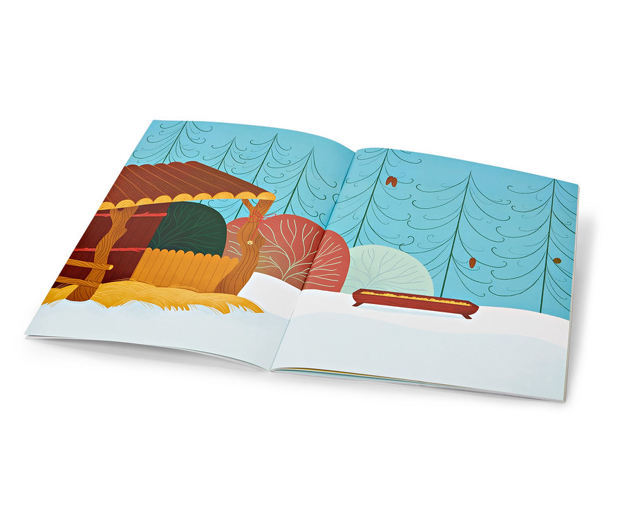 Geöffnetes Buch mit Illustration einer Winterlandschaft, im Vordergrund ein kleines Haus.