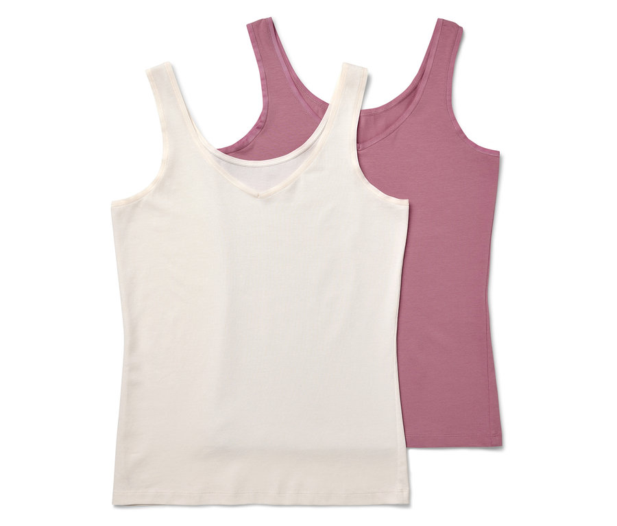 Zwei Tanktops, eines in Creme und eines in Rosa, liegen übereinander.