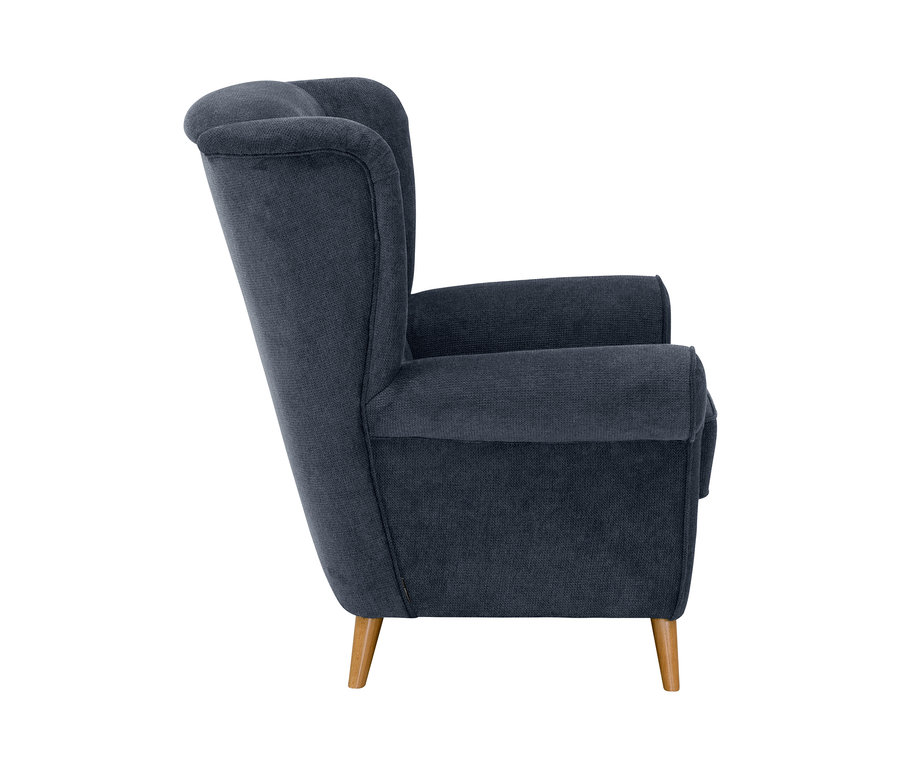 Seitenansicht des dunkelblauen Ohrensessels »Anton«.