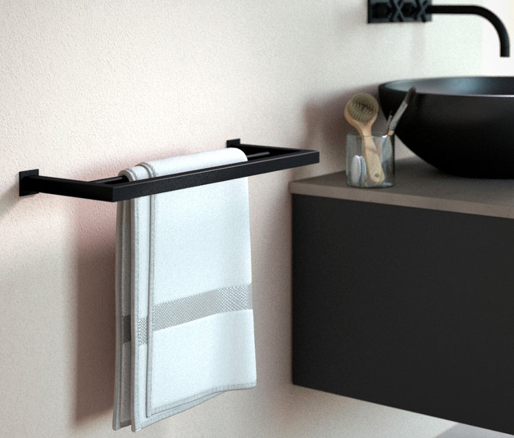 Ein schwarzer Handtuchhalter »Stenni« hängt an der Wand mit einem weißen Handtuch.