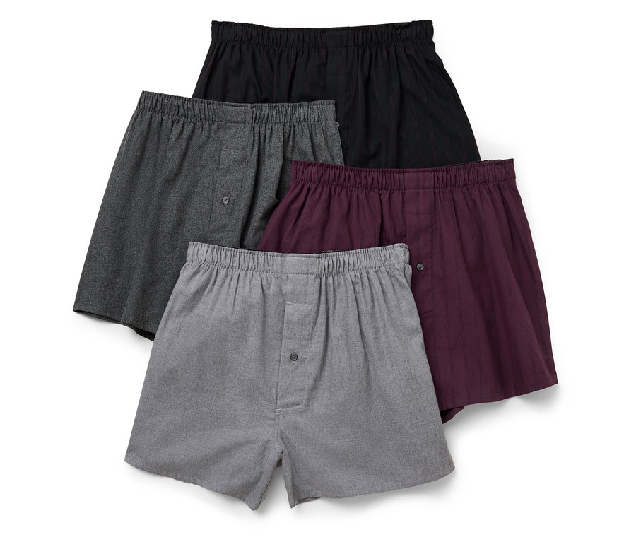 Vier Herrenboxershorts in verschiedenen Farben: hellgrau, dunkelgrau, bordeauxrot und schwarz.