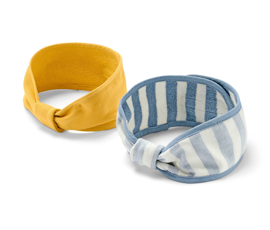 Zwei Kosmetik-Stirnbänder, einfarbig gelb und weiß-blau gestreift.