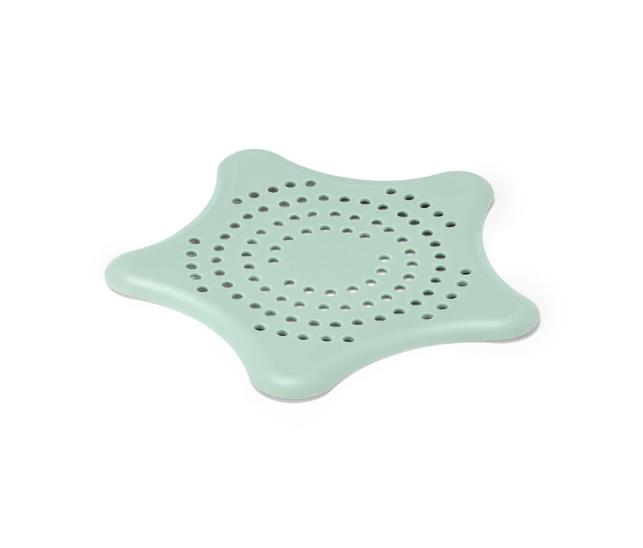 Ein mintgrünes Abflusssieb in Sternform.