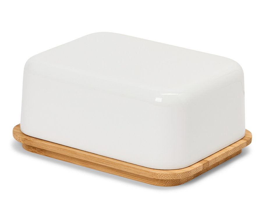 Eine weiße Butterdose mit Bambusdeckel steht auf einer weißen Oberfläche.