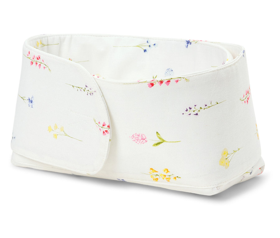 Eine weiße Aufbewahrungsbox mit Blumenmuster.