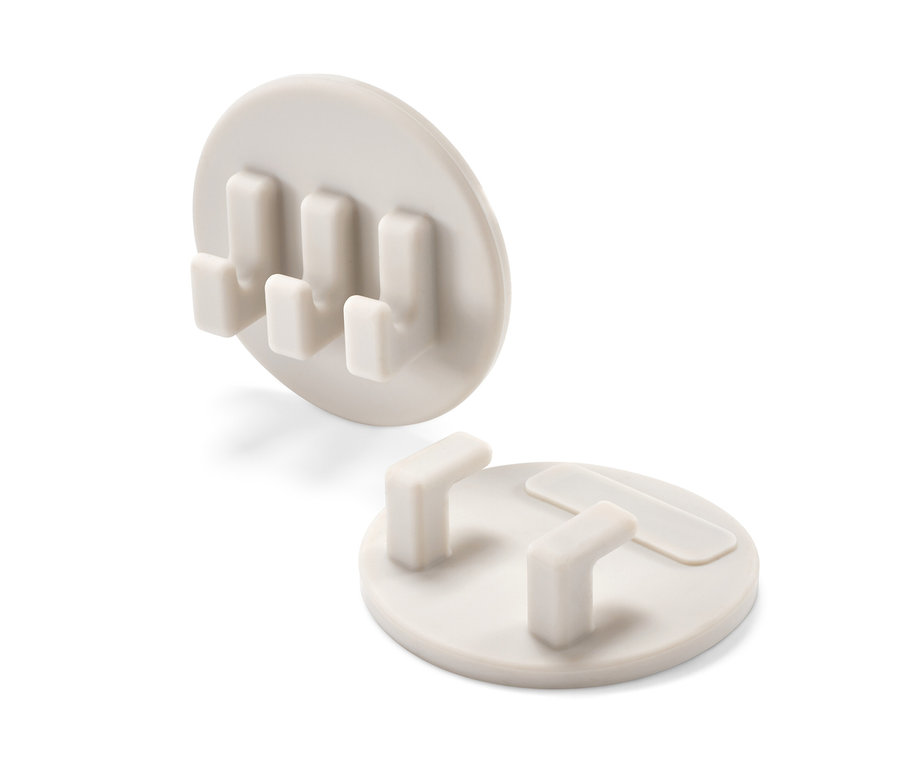 Zwei selbsthaftende Halter-Sets.