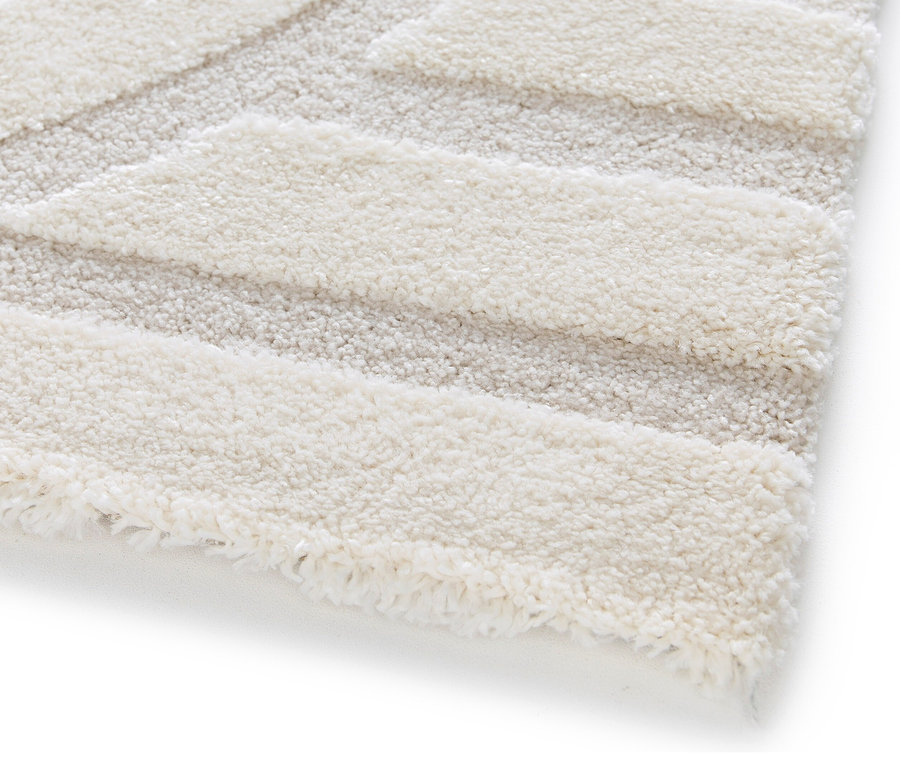 Detailansicht eines beigen Teppichs »Cosmo«.