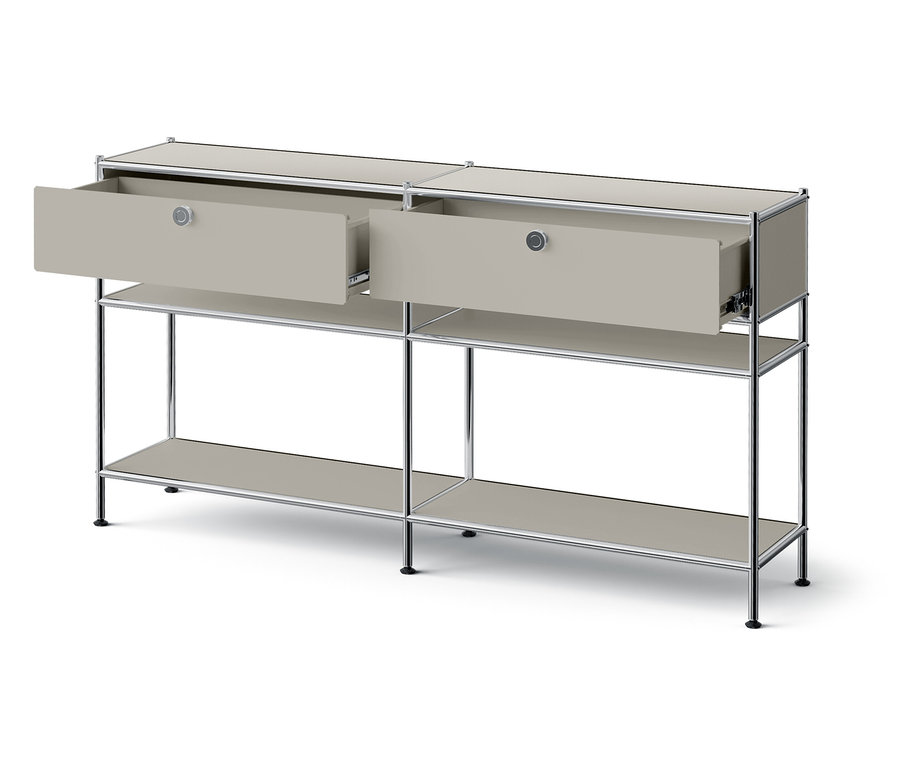 Grauer Couchtisch mit zwei offenen Schubladen.