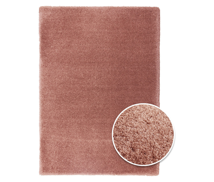 Ein rechteckiger, rostroter Teppich »Pleasure« mit Detailaufnahme der Textur.