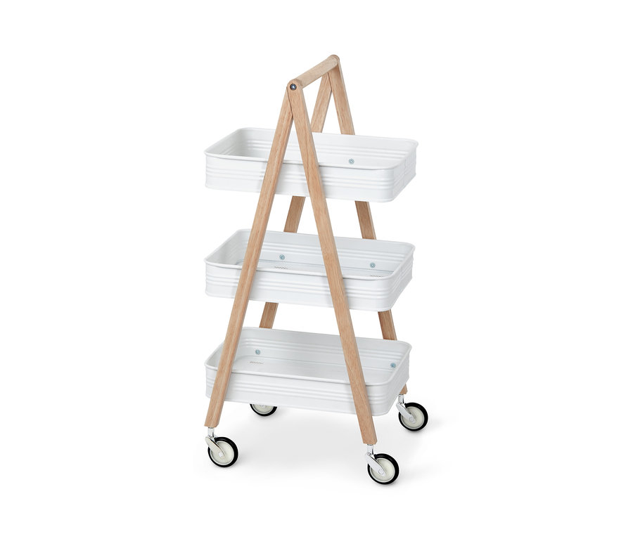 Weißer Rollwagen mit drei Ablagen und hellem Holzrahmen.
