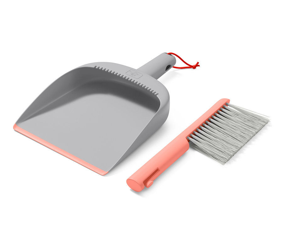 Grauer Handkehrer und Schaufel mit pinkfarbenen Details.