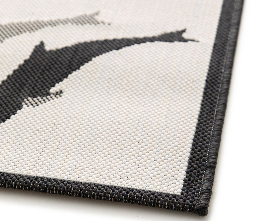 Detailaufnahme einer Ecke des Kinderteppichs LINIA Weltkarte, ca. 133 x 190 cm.