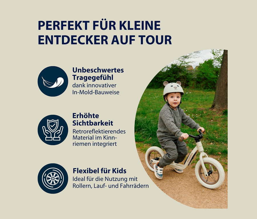 Junge auf Laufrad trägt HUDORA Kinderhelm, Beary, 44–47 cm.