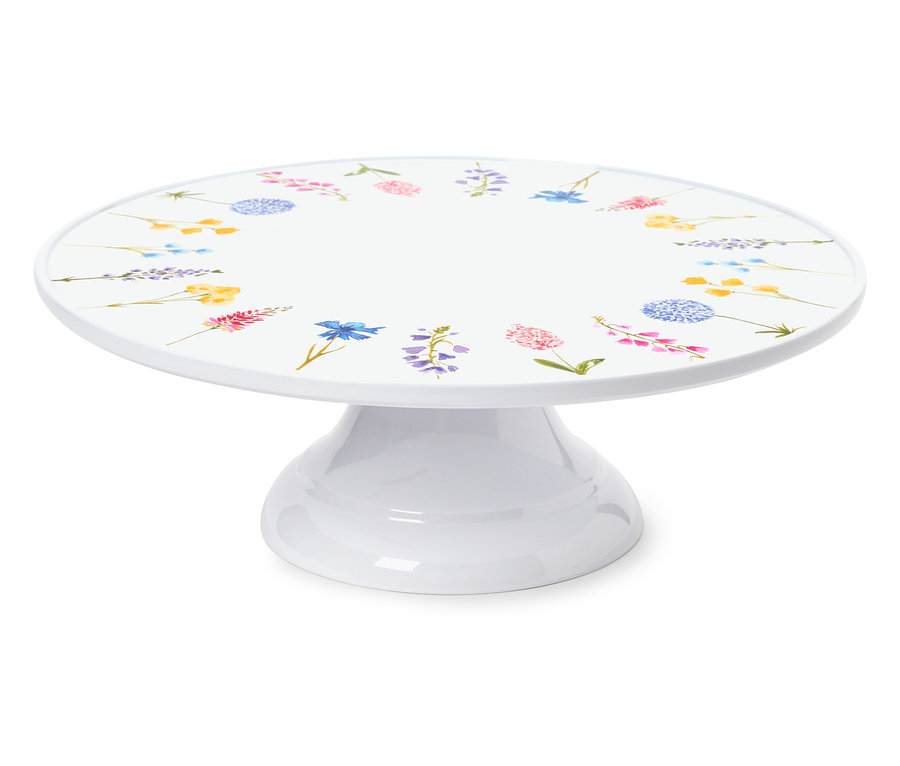 Weißer Kuchenständer mit Blumenmuster.