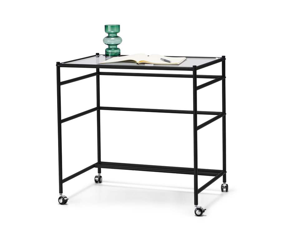 Glasschreibtisch »CN3« mit Rollen. Auf dem Tisch liegen ein offener Notizblock und eine grüne Vase.
