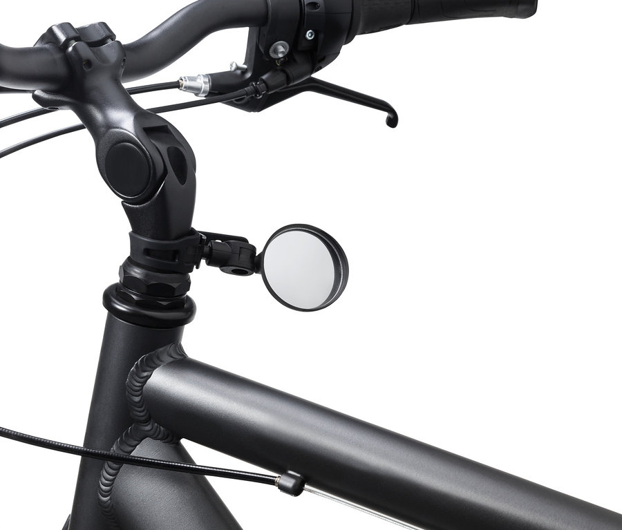 Detailaufnahme eines Fahrrads mit schwarzem Lenker und einem Mini-Fahrradspiegel.