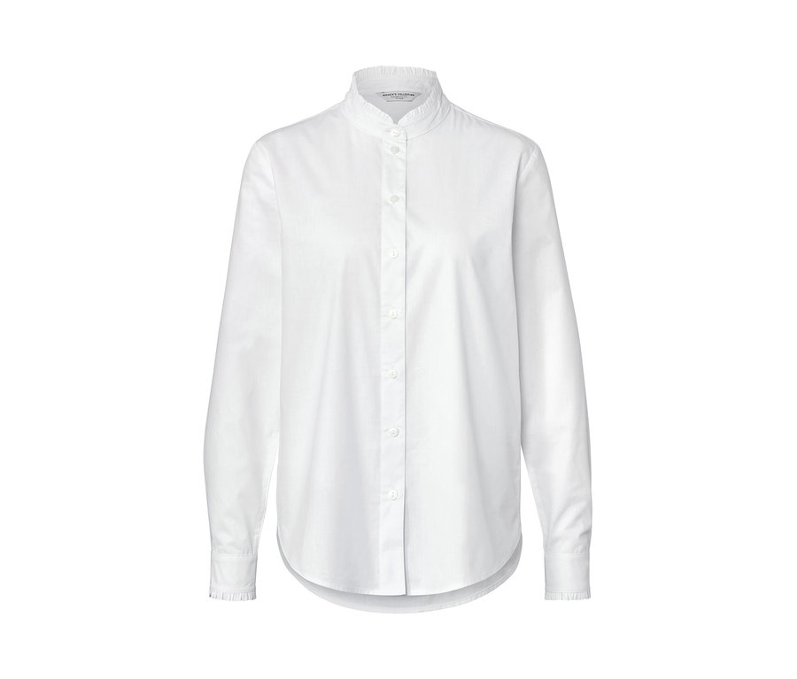 Weisse Bluse mit Rüschendetail.