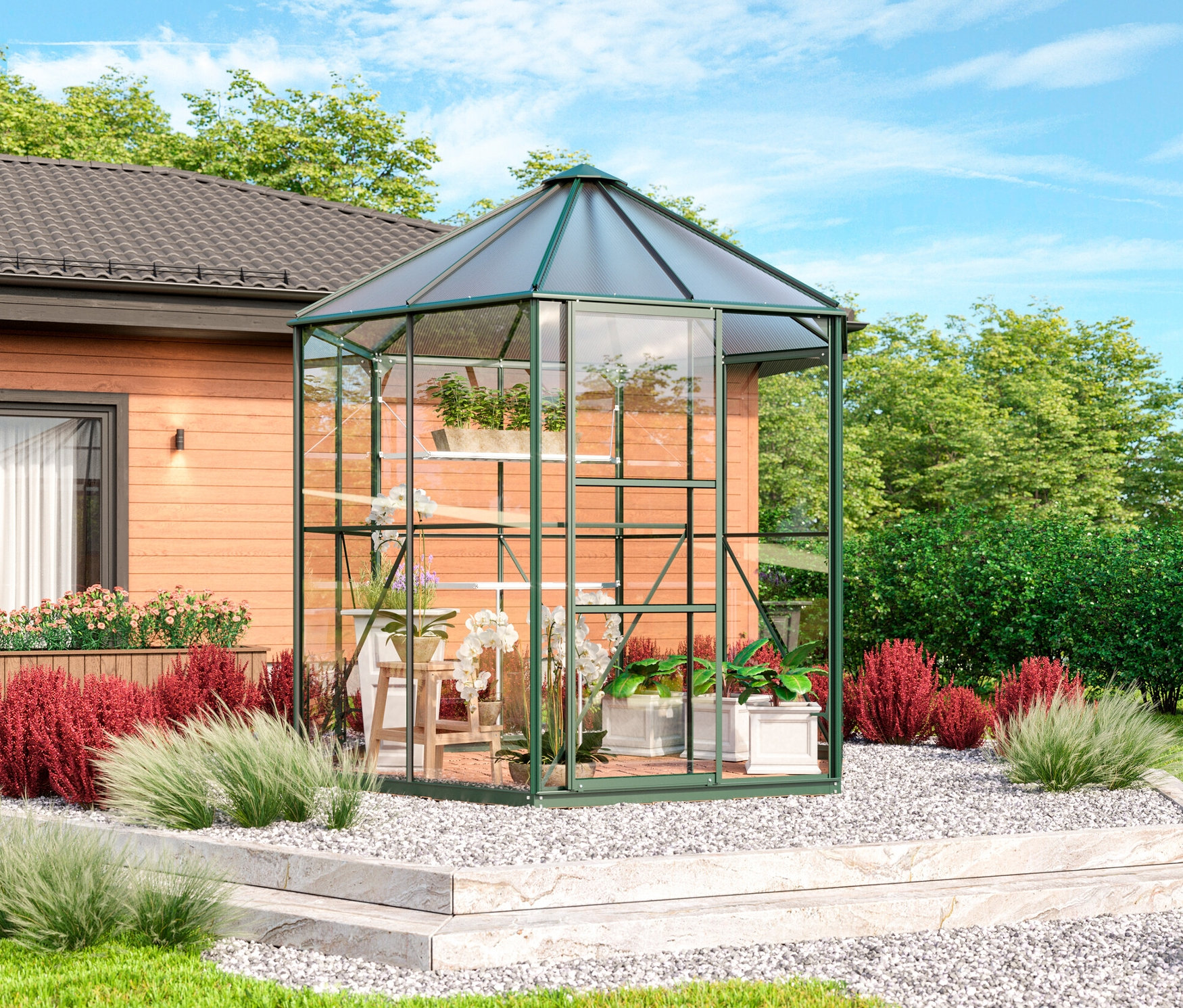 Ein smaragdgrünes Vitavia Gewächshaus Pavillon 4,5 m² inklusive Fundamentrahmen steht im Garten.