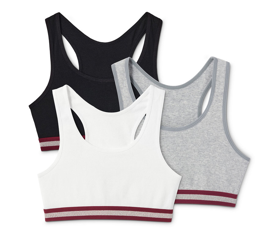 Drei Bustiers in Schwarz, Grau und Weiß.