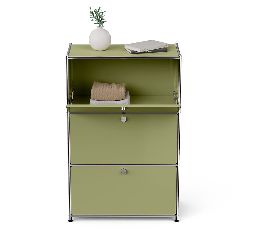 Ein grüner Schrank mit zwei Schubladen und einem offenen Oberteil. Auf der Oberseite befinden sich eine Vase und ein Buch.