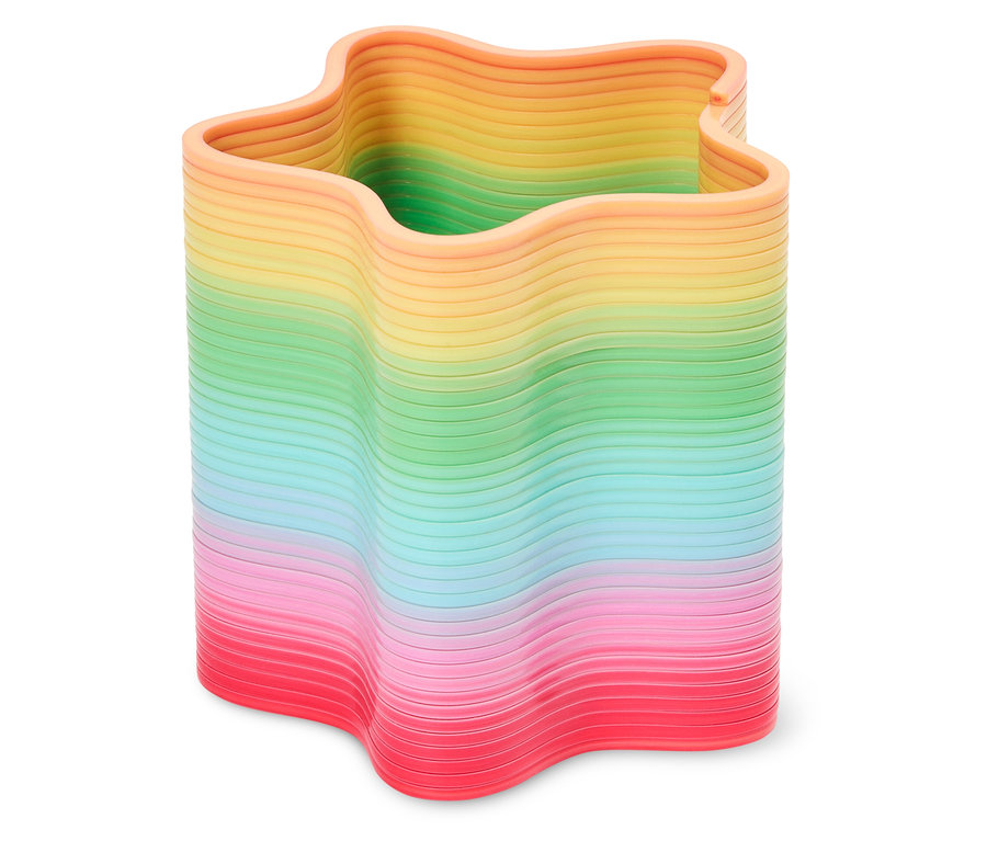 Ein sternförmiger, regenbogenfarbener Stifthalter steht auf einer weißen Oberfläche.