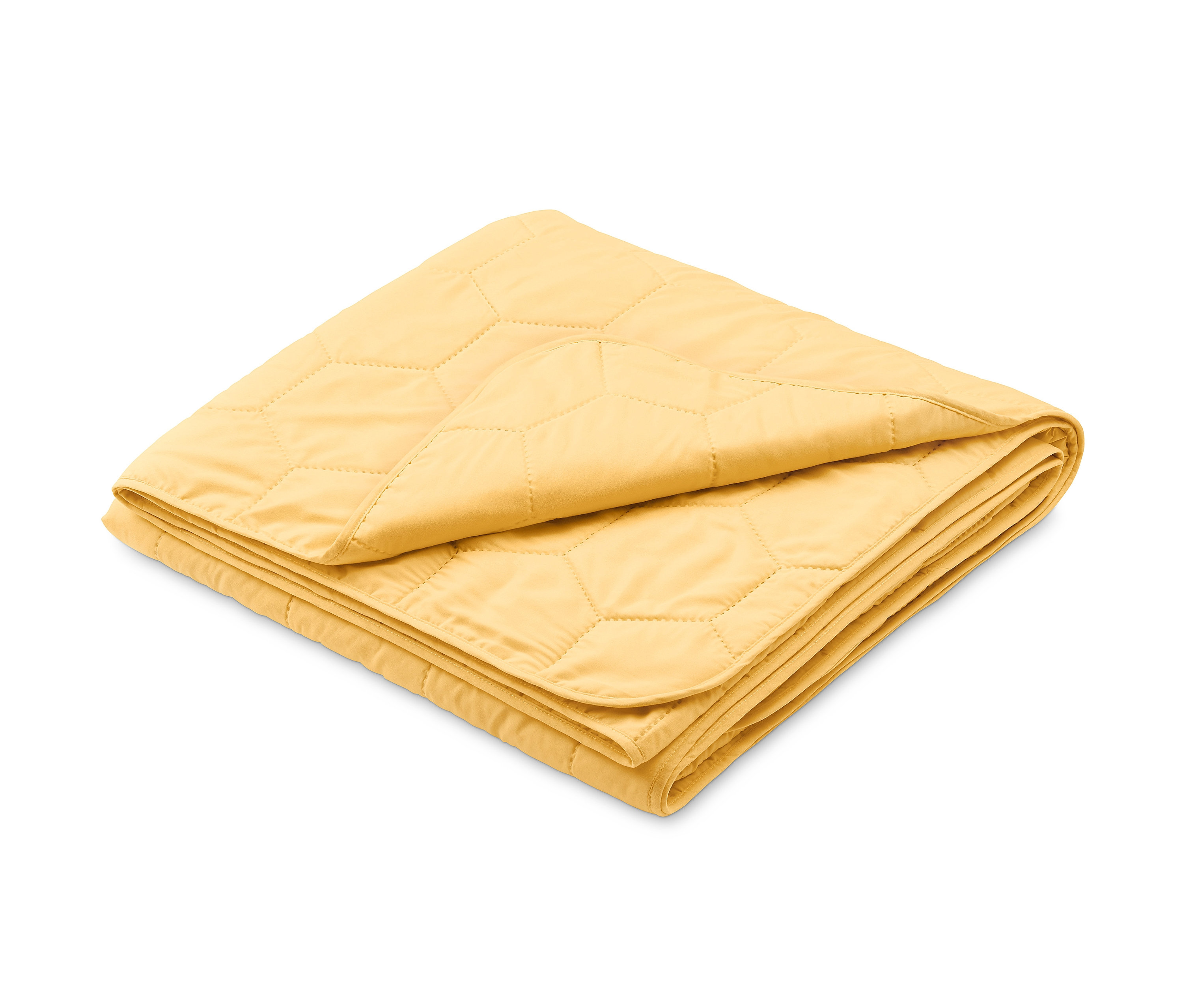 Ein gelber Bettüberwurf mit Wabenmuster liegt gefaltet.