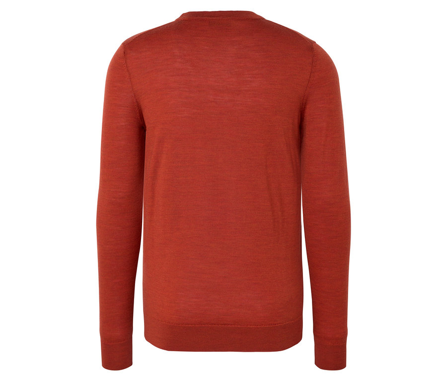 Nahaufnahme eines orange melierten Merino-Pullovers.