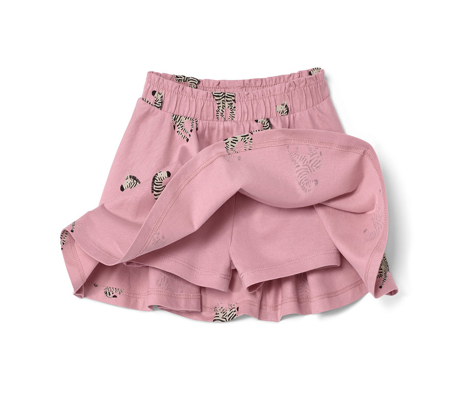Nahaufnahme des Kinder-Jerseyrocks mit Hose in Rosa mit Zebramuster.