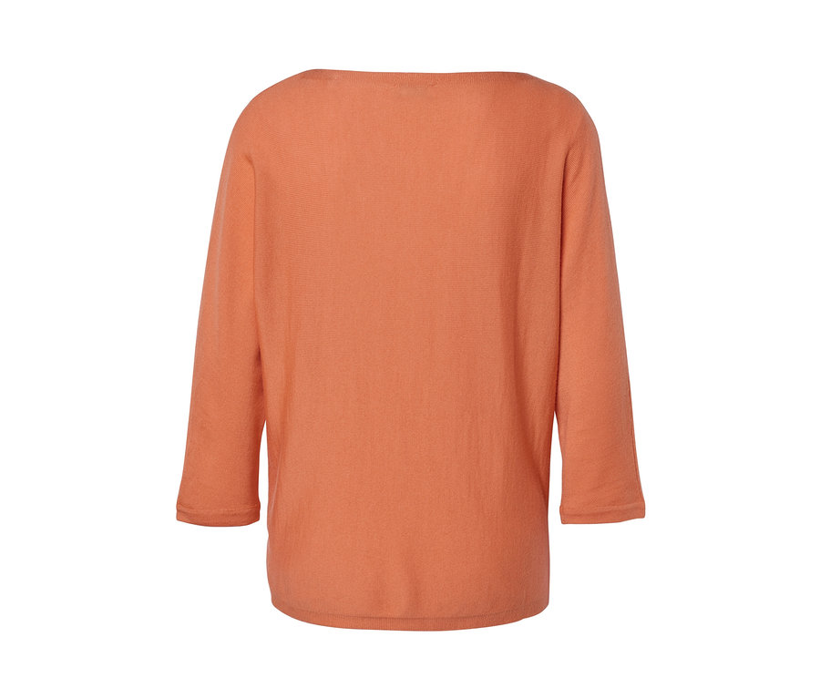 Pfirsichfarbener Merino-Feinstrickpullover.