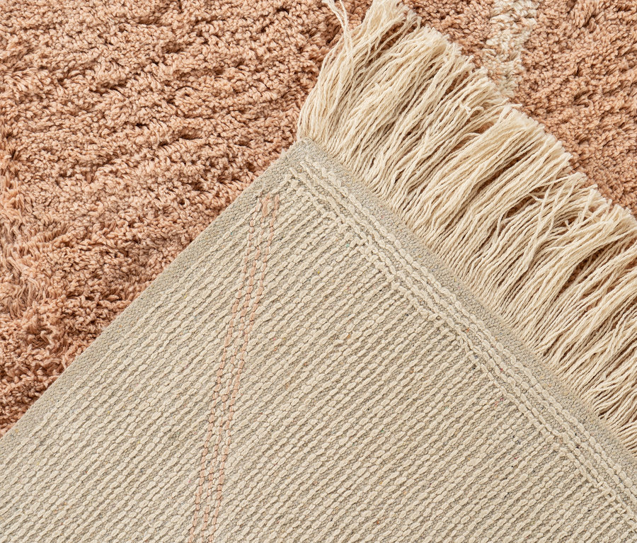 Detailansicht eines creme-braunen Kayoom Teppichs »Mylen« mit Fransen.