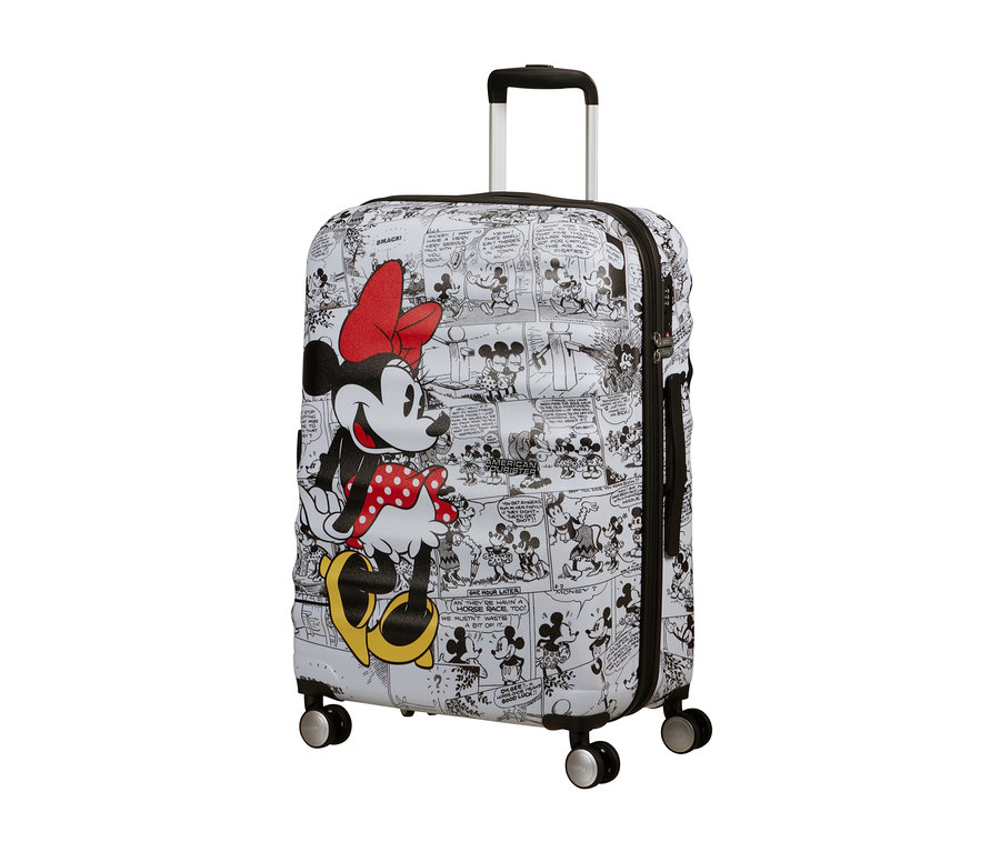 Ein mittelgroßer American Tourister Wavebreaker »Minnie Mouse« Koffer mit Comic-Mickey-Mouse-Aufdruck, ausziehbarem Griff und vier Rädern.