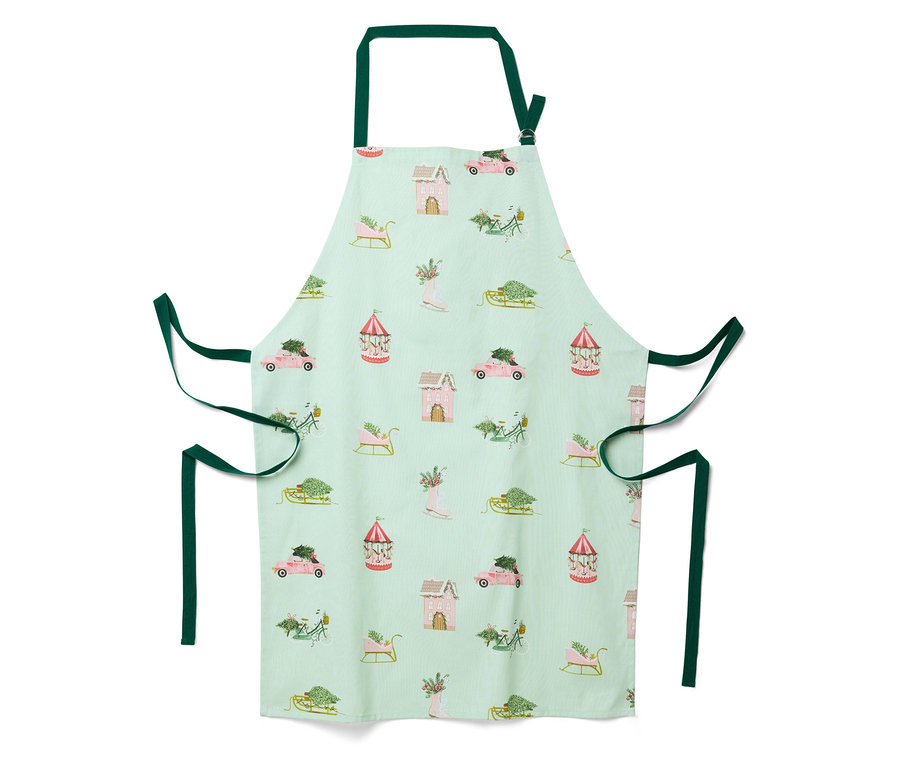 Hellgrüne Schürze mit weihnachtlichem Muster aus Häusern, Autos, Schlitten und Karussells.