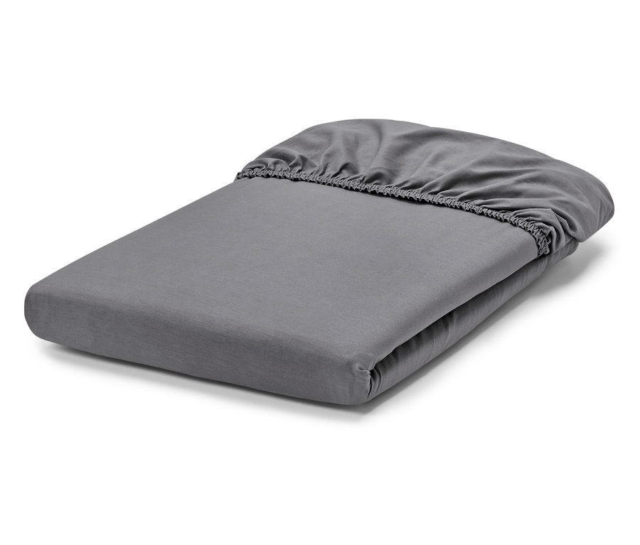 Gefaltetes graues Spannbettlaken.